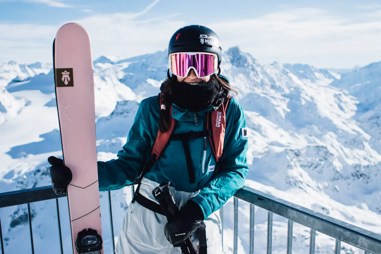 Elina on a mountain viewpoint with her skis